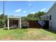 Fenced backyard featuring a swing and decorative art at 5323 Flat Creek Rd, Heath Springs, SC 29058