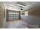 Spacious one car garage with concrete floors and overhead storage at 5323 Flat Creek Rd, Heath Springs, SC 29058