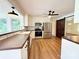 Eat-in kitchen featuring a breakfast bar, stainless appliances, and a sliding barn door at 5323 Flat Creek Rd, Heath Springs, SC 29058