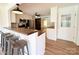 Modern kitchen includes eat-in bar, stainless appliances, and view into adjoining room at 5323 Flat Creek Rd, Heath Springs, SC 29058