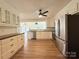 Modern kitchen with white cabinets and stainless steel appliances at 5323 Flat Creek Rd, Heath Springs, SC 29058