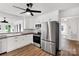 Modern kitchen featuring stainless steel appliances, white cabinets and subway tile at 5323 Flat Creek Rd, Heath Springs, SC 29058