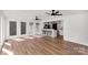 Open-concept living room featuring bar seating and multiple windows for great lighting at 5323 Flat Creek Rd, Heath Springs, SC 29058