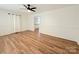 Open-concept living room features bright walls and wood-look flooring at 5323 Flat Creek Rd, Heath Springs, SC 29058