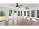 Sunroom with laminate floors and many windows offering views of the backyard at 5323 Flat Creek Rd, Heath Springs, SC 29058