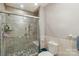 Bathroom with an enclosed tile shower, pebble floor and grab bars at 5626 Sandhurst Rd, Hickory, NC 28602