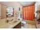 Traditional bathroom featuring a single sink vanity and shower-tub combo at 5626 Sandhurst Rd, Hickory, NC 28602