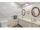 Bathroom featuring a double sink vanity, tile floors and framed mirrors at 5626 Sandhurst Rd, Hickory, NC 28602