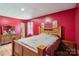 Bedroom with wood floors, natural light, and neutral tones at 5626 Sandhurst Rd, Hickory, NC 28602