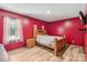 Bedroom with wood floors, natural light, and neutral tones at 5626 Sandhurst Rd, Hickory, NC 28602