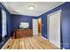 Bedroom with wood floors, window, closet, and a cabinet at 5626 Sandhurst Rd, Hickory, NC 28602
