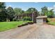 An exterior side-view of the traditional brick home with an attached garage and a paved driveway at 5626 Sandhurst Rd, Hickory, NC 28602