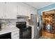 Modern kitchen boasts stainless steel appliances, marble countertops, and ample cabinet space at 5626 Sandhurst Rd, Hickory, NC 28602