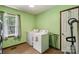 Dedicated laundry room with washer, dryer, and natural light at 5626 Sandhurst Rd, Hickory, NC 28602