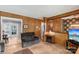 Inviting living room with light floors, wood walls, and easy access to the dining area at 5626 Sandhurst Rd, Hickory, NC 28602