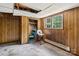 Room with wood paneled walls, a window providing natural light and closet storage at 5626 Sandhurst Rd, Hickory, NC 28602