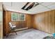 Room with wood paneled walls and a window providing natural light at 5626 Sandhurst Rd, Hickory, NC 28602