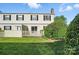 Lush backyard featuring green lawn, trees, and a quaint picket fence at 5947 Quail Hollow Rd # A, Charlotte, NC 28210