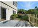 Charming backyard with patio, picket fence, and lush garden at 5947 Quail Hollow Rd # A, Charlotte, NC 28210