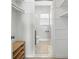 En-suite bathroom featuring storage shelves, neutral tile flooring, and a toilet at 5947 Quail Hollow Rd # A, Charlotte, NC 28210