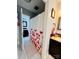 Bright bathroom featuring a white shower curtain with floral designs, a dark wood vanity, and a decorative mirror at 5947 Quail Hollow Rd # A, Charlotte, NC 28210