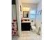 Updated bathroom with decorative mirror, stylish light fixture, and floral shower curtain at 5947 Quail Hollow Rd # A, Charlotte, NC 28210