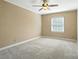 Neutral bedroom with a ceiling fan and a window providing natural light at 5947 Quail Hollow Rd # A, Charlotte, NC 28210