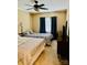 Cozy bedroom featuring two beds, neutral carpet, and a ceiling fan for added comfort at 5947 Quail Hollow Rd # A, Charlotte, NC 28210
