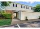 Charming two-story home with a combination of brick and siding, complemented by well-maintained landscaping at 5947 Quail Hollow Rd # A, Charlotte, NC 28210