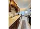 Functional kitchen with modern stainless steel appliances, tile floors, and updated countertops at 5947 Quail Hollow Rd # A, Charlotte, NC 28210