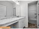 A well-lit bathroom features a marble countertop, white cabinets, and a tiled shower-tub combo at 6328 Busch Way, Midland, NC 28107