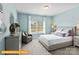 Bedroom with calming blue walls and natural light and decor at 6328 Busch Way, Midland, NC 28107