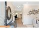 Inviting entryway with hardwood floors, decorative mirror, and art leading to dining area at 6328 Busch Way, Midland, NC 28107