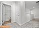Hallway showing laundry room with hookups with neutral paint and carpet, offering convenience at 6328 Busch Way, Midland, NC 28107