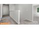 Neutral-toned upper level hallway featuring plush carpeting and access to multiple rooms at 6328 Busch Way, Midland, NC 28107