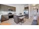 Kitchen with stainless steel appliances, island with seating, and ample counter space at 6328 Busch Way, Midland, NC 28107