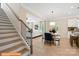 Open concept staircase leads to living area with natural light and modern finishes throughout at 6328 Busch Way, Midland, NC 28107