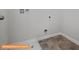 A utility room boasts tile floors and connections for a washer and dryer at 6328 Busch Way, Midland, NC 28107
