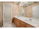 This bathroom features a double vanity with ample cabinet storage and wallpaper at 7189 Bovine Ln # 28, Harrisburg, NC 28075