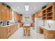 Well-lit kitchen boasts wooden cabinets and ample counter space at 7189 Bovine Ln # 28, Harrisburg, NC 28075