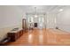 Spacious living room with beautiful hardwood floors, neutral walls, and traditional furnishings that exude warmth at 7189 Bovine Ln # 28, Harrisburg, NC 28075