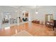 Open-concept living room with hardwood floors, carpeted seating area and vaulted ceilings at 7189 Bovine Ln # 28, Harrisburg, NC 28075