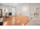 Bright living room featuring hardwood floors, elegant columns, and large windows that provide abundant natural light at 7189 Bovine Ln # 28, Harrisburg, NC 28075