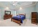 This bedroom features a decorative ceiling, ceiling fan, and an area rug at 7189 Bovine Ln # 28, Harrisburg, NC 28075