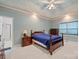 This bedroom features an ensuite bathroom, decorative ceiling, and an area rug at 7189 Bovine Ln # 28, Harrisburg, NC 28075
