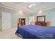 This bedroom features a decorative ceiling, large area rug, and furnishings at 7189 Bovine Ln # 28, Harrisburg, NC 28075