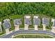 Aerial view of homes showcasing landscaped lawns, mature trees, backyards with pools and outdoor living spaces at 7339 Millstone Sw Cir, Concord, NC 28025