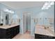 Bathroom with double sinks, tile floors, and lots of counter space at 7339 Millstone Sw Cir, Concord, NC 28025