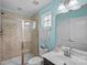 Bathroom features a shower with glass door, toilet and vanity at 7339 Millstone Sw Cir, Concord, NC 28025
