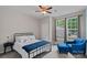 Bedroom with natural light, neutral colors, and a backyard view at 7339 Millstone Sw Cir, Concord, NC 28025